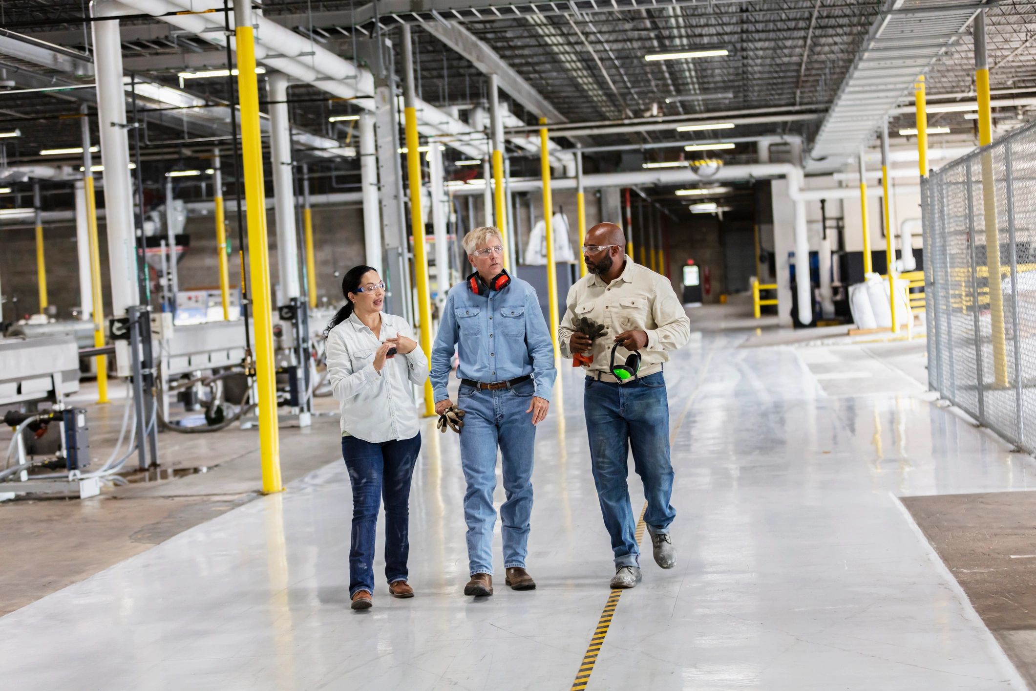 Team walking through a manufacturing facility