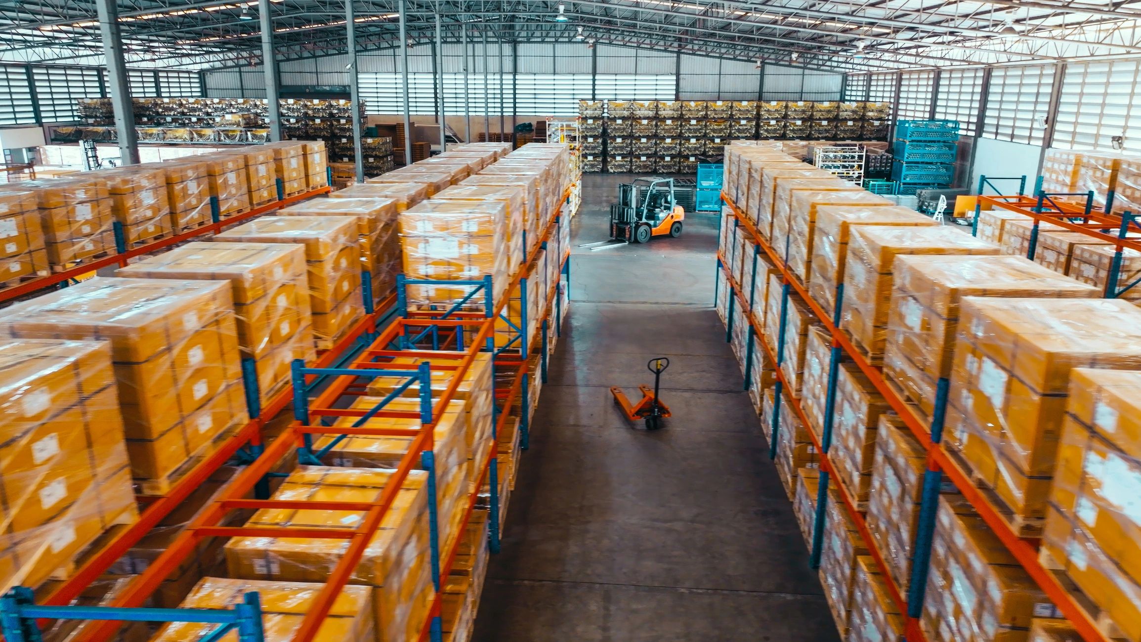 Warehouse shelves with packaged orders ready for review and dispatch