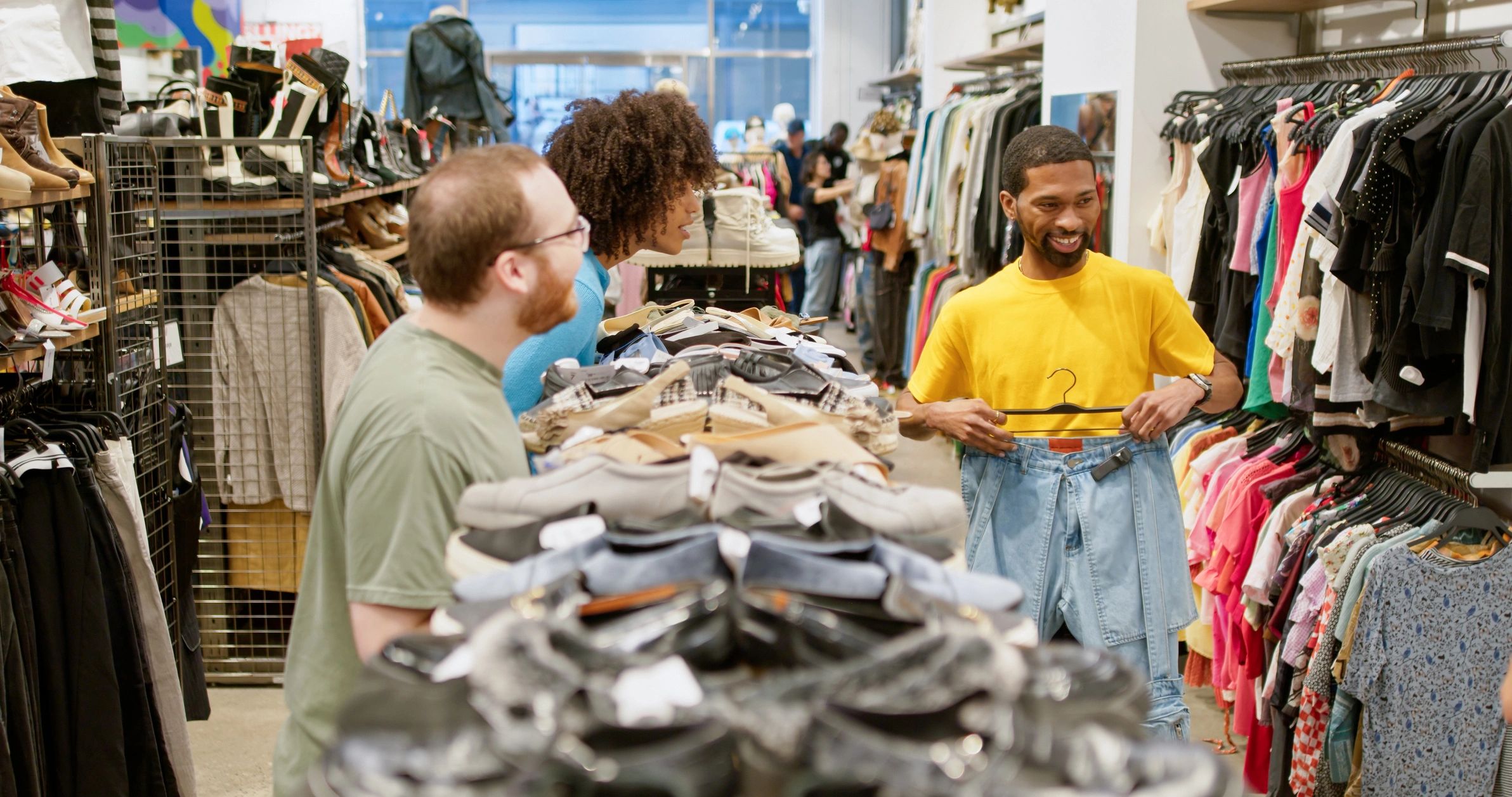 Team reviewing garments in a fashion retail environment